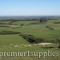 Looking down onto the Canterbury Plain on the South Island of New Zealand. It's great sheep country that's gradually being converted to dairy cattle (if they have irrigation rights) because the return/acre is higher and their is strong demand in China for milk powder. The trees are windbreaks to reduce the effect of the drying winds that occur here.