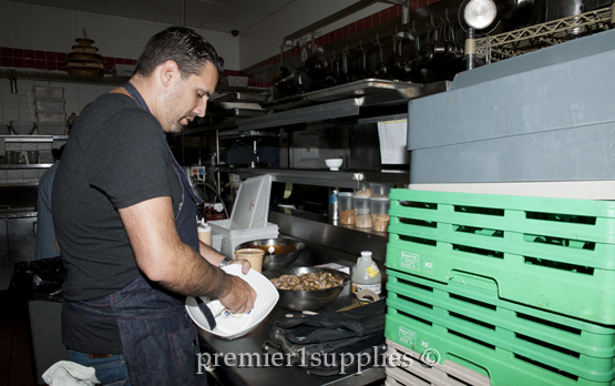 Chef Michael Scelfo prepping in the kitchen.